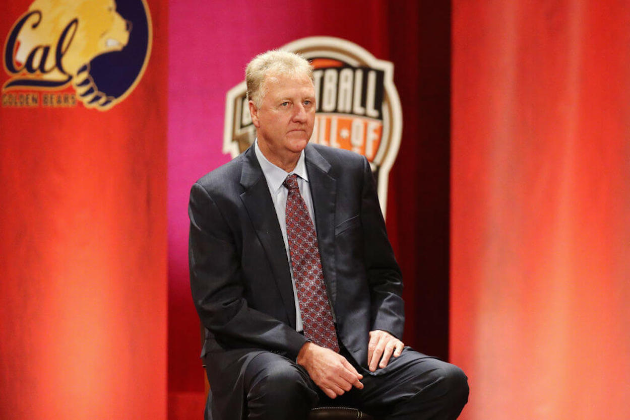 Larry Bird sits on stage during the 2018 Basketball Hall of Fame Enshrinement Ceremony