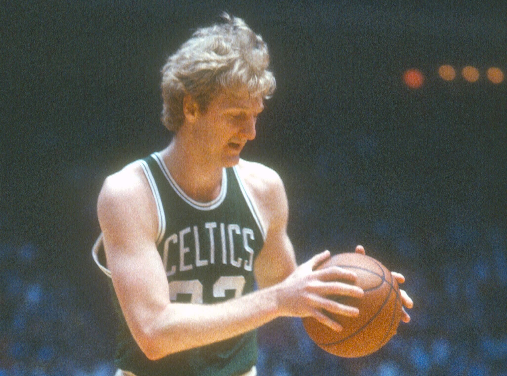 Larry Bird of the Boston Celtics looks to make a move.