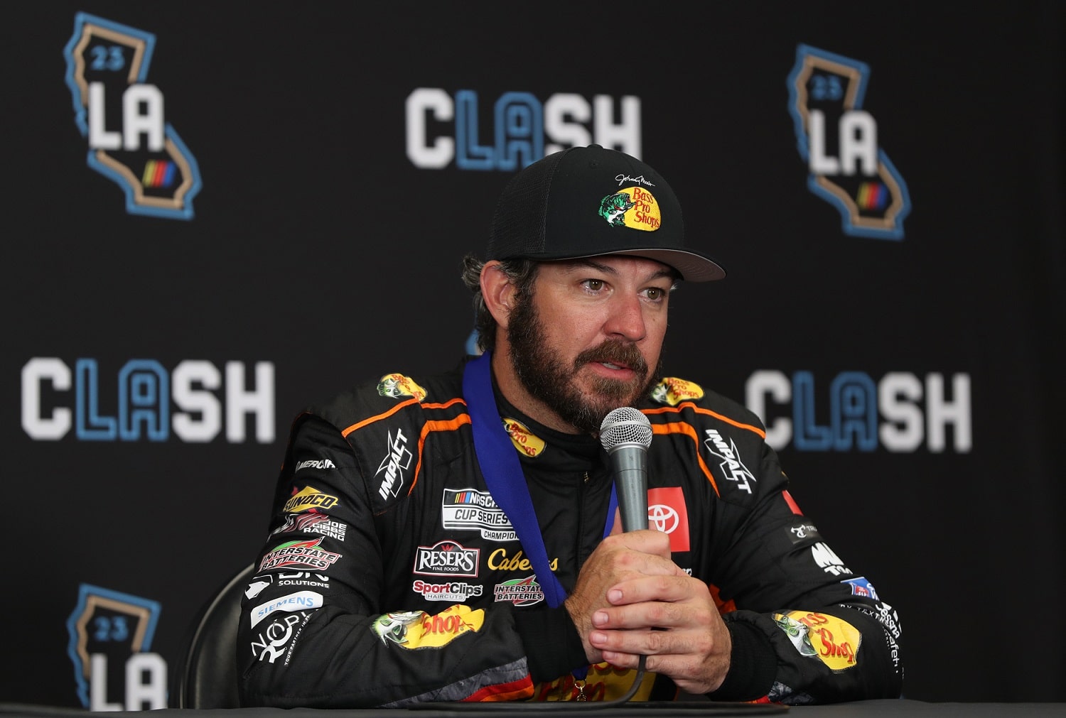 Martin Truex Jr. speaks to the media after wining the NASCAR Clash at the Coliseum on Feb. 5, 2023. | Meg Oliphant/Getty Images