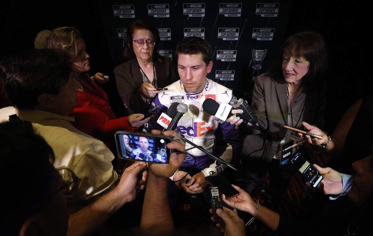 Denny Hamlin speaks with the media during the NASCAR Cup Series Playoff Media Day in 2022