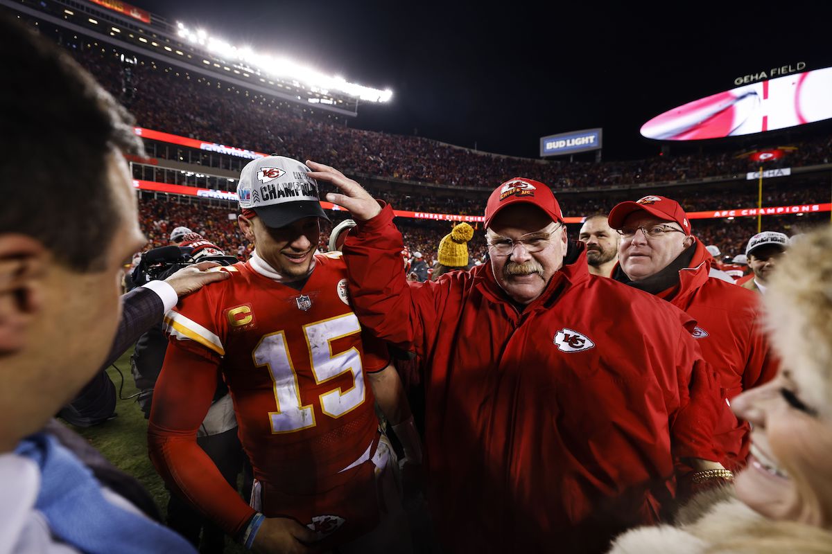 Patrick Mahomes and Andy Reid celebrate on the field after winning the AFC Championship game against the Cincinnati Bengals
