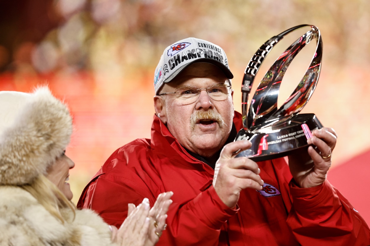 Kansas City Chiefs head coach Andy Reid celebrates with the Lamar Hunt Trophy.