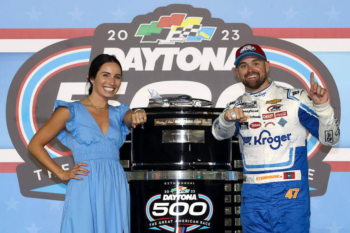 Ricky Stenhouse Jr. and his wife, Madyson Joye Stenhouse, celebrate after winning the 65th Daytona 500.