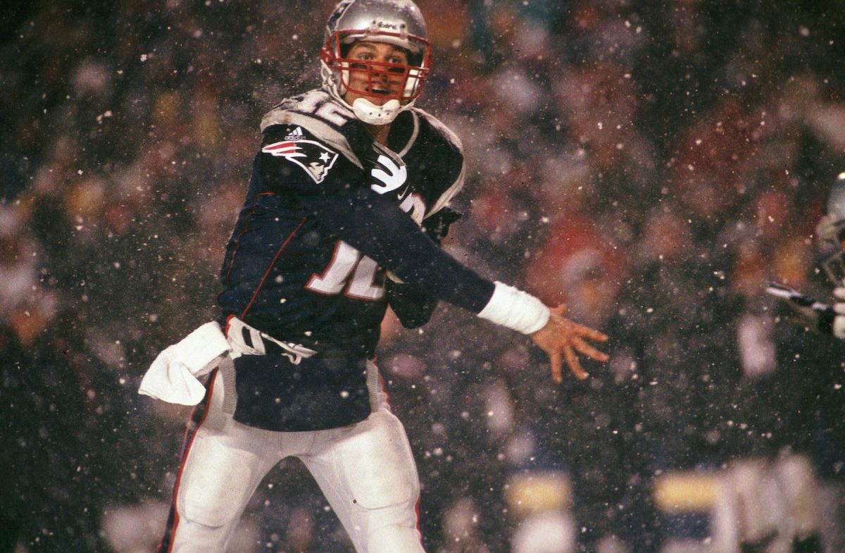 New England Patriots quarterback Tom Brady completes a pass against the Oakland Raiders in the 2002 AFC Championship Game