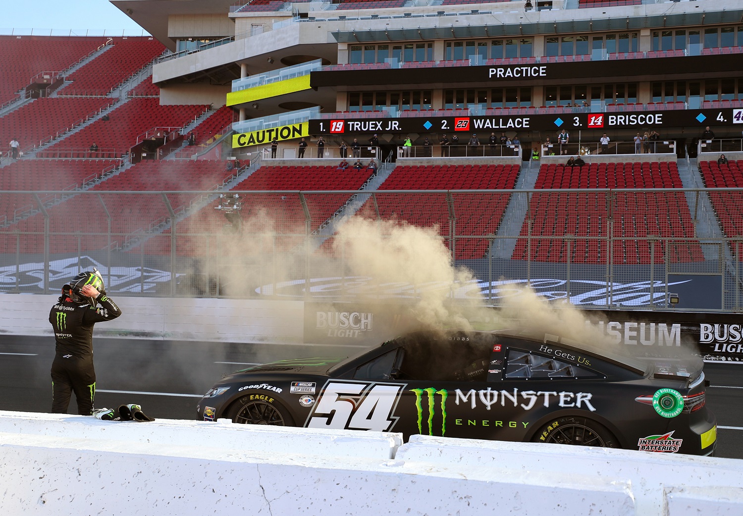 Ty Gibbs, driver of the No. 54 Monster Energy Toyota, exits his car after an on-track incident during practice for the Busch Light Clash at the Los Angeles Coliseum on Feb. 4, 2023.