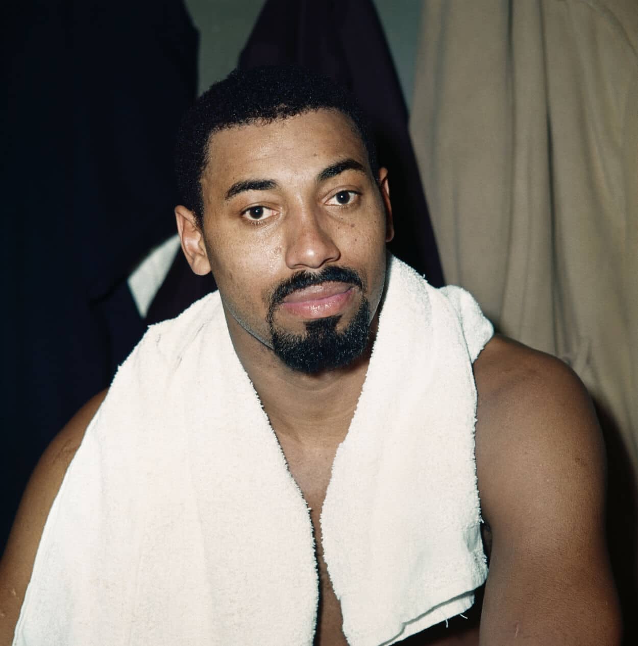 Wilt Chamberlain in his home with some of his trophies.