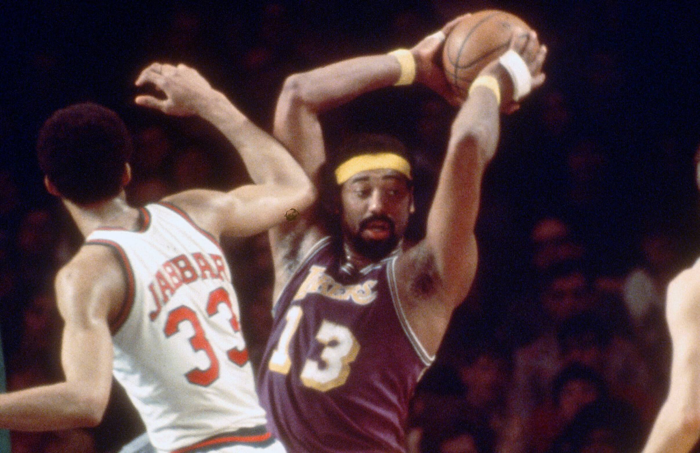 Wilt Chamberlain of the Los Angeles Lakers looks to pass.