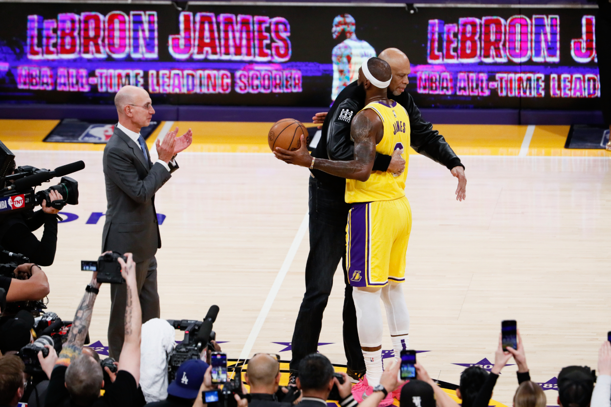 LeBron James, right, hugs Kareem Abdul-Jabbar after becoming the all-time NBA scoring leader.