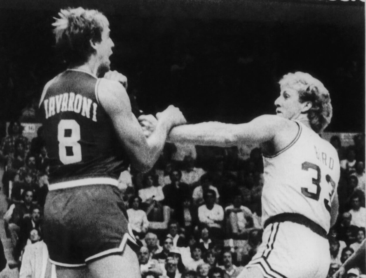 Philadelphia 76ers forward Marc Iavaroni and Boston Celtics star Larry Bird trade punches.