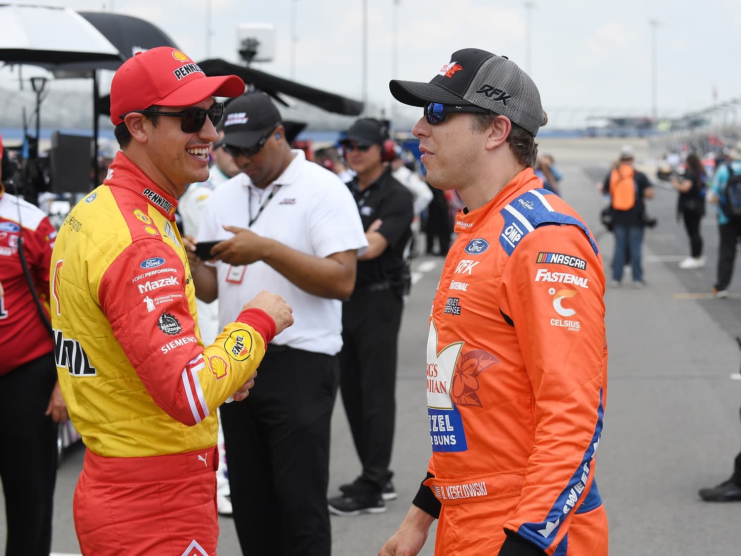 Joey Logano and Brad Keselowski talk during qualifying for the NASCAR Cup Series Ally 400 on June 25, 2022, at Nashville Superspeedway.