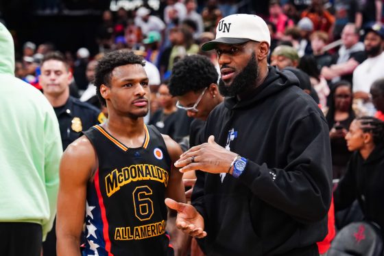 Bronny James and LeBron James talk at the 2023 McDonald's All-American Game.