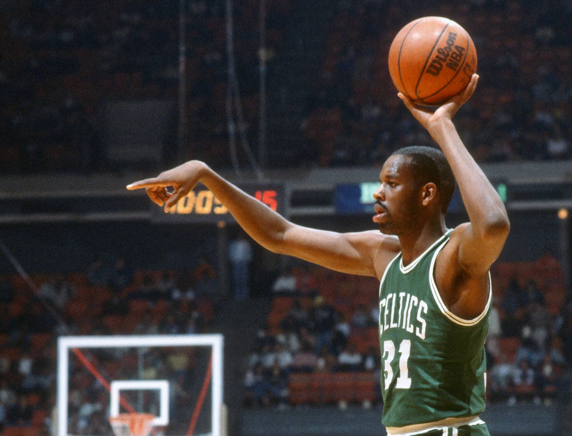 Cedric Maxwell of the Boston Celtics looks to pass the ball.