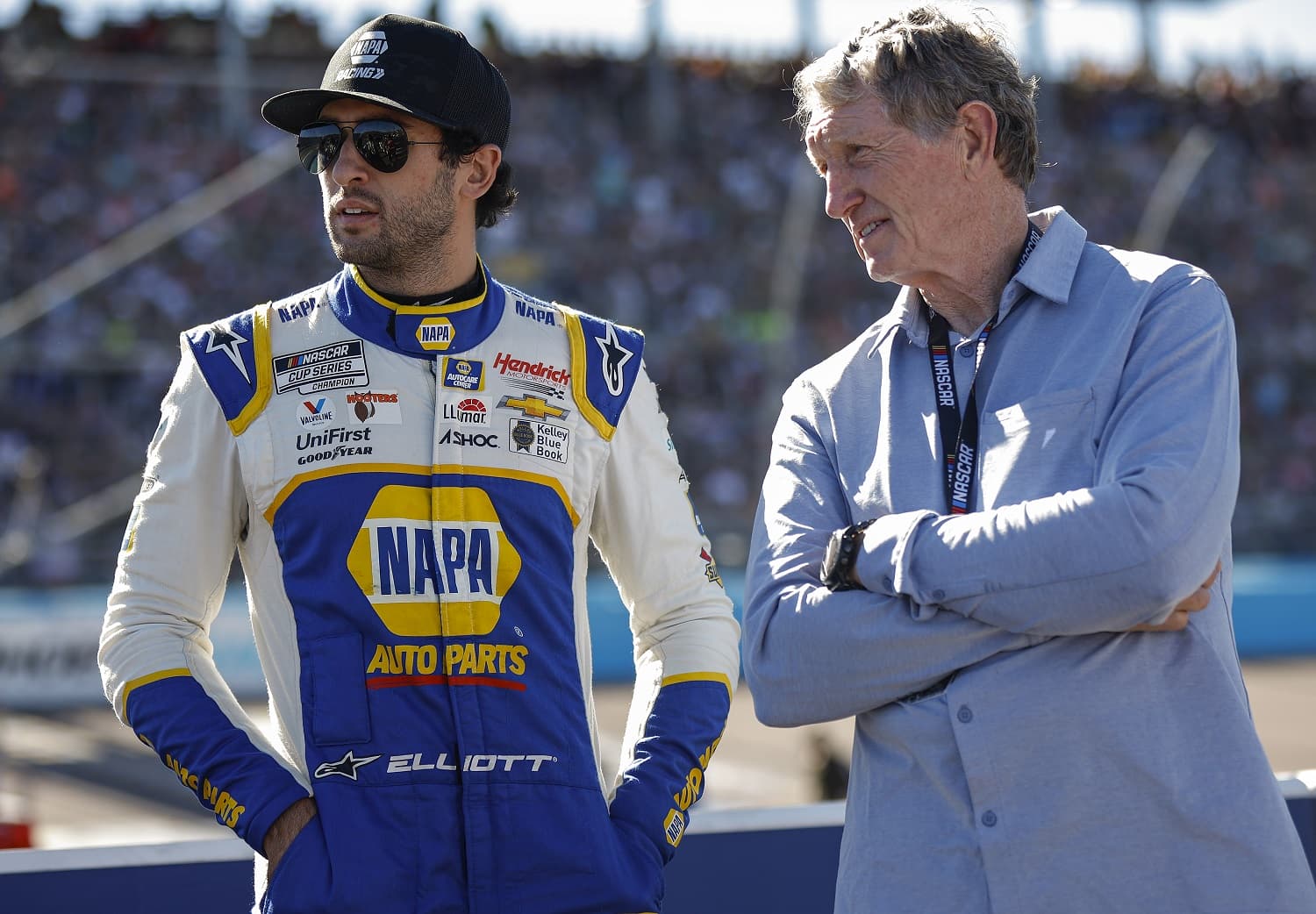 Chase Elliott talks to his father, Hall of Famer Bill Elliott, on the grid prior to the NASCAR Cup Series Championship at Phoenix Raceway on Nov. 6, 2022.