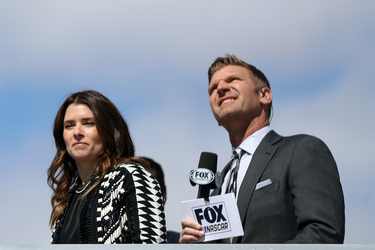 Danica Patrick  and Clint Bowyer look on during pre-race ceremonies prior to the NASCAR Cup Series Pennzoil 400 at Las Vegas Motor Speedway on March 6, 2022. | Meg Oliphant/Getty Images