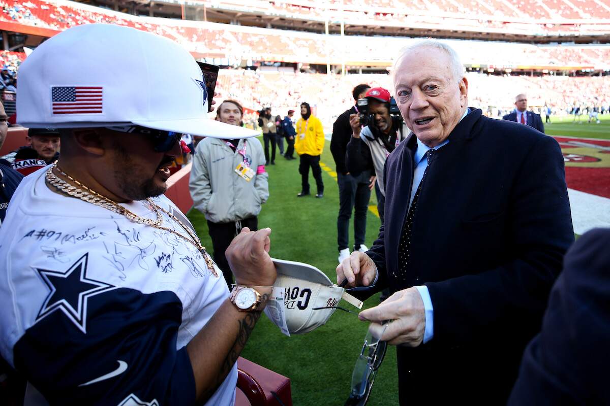 Dallas Cowboys owner Jerry Jones signs autographs prior to a 2023 game