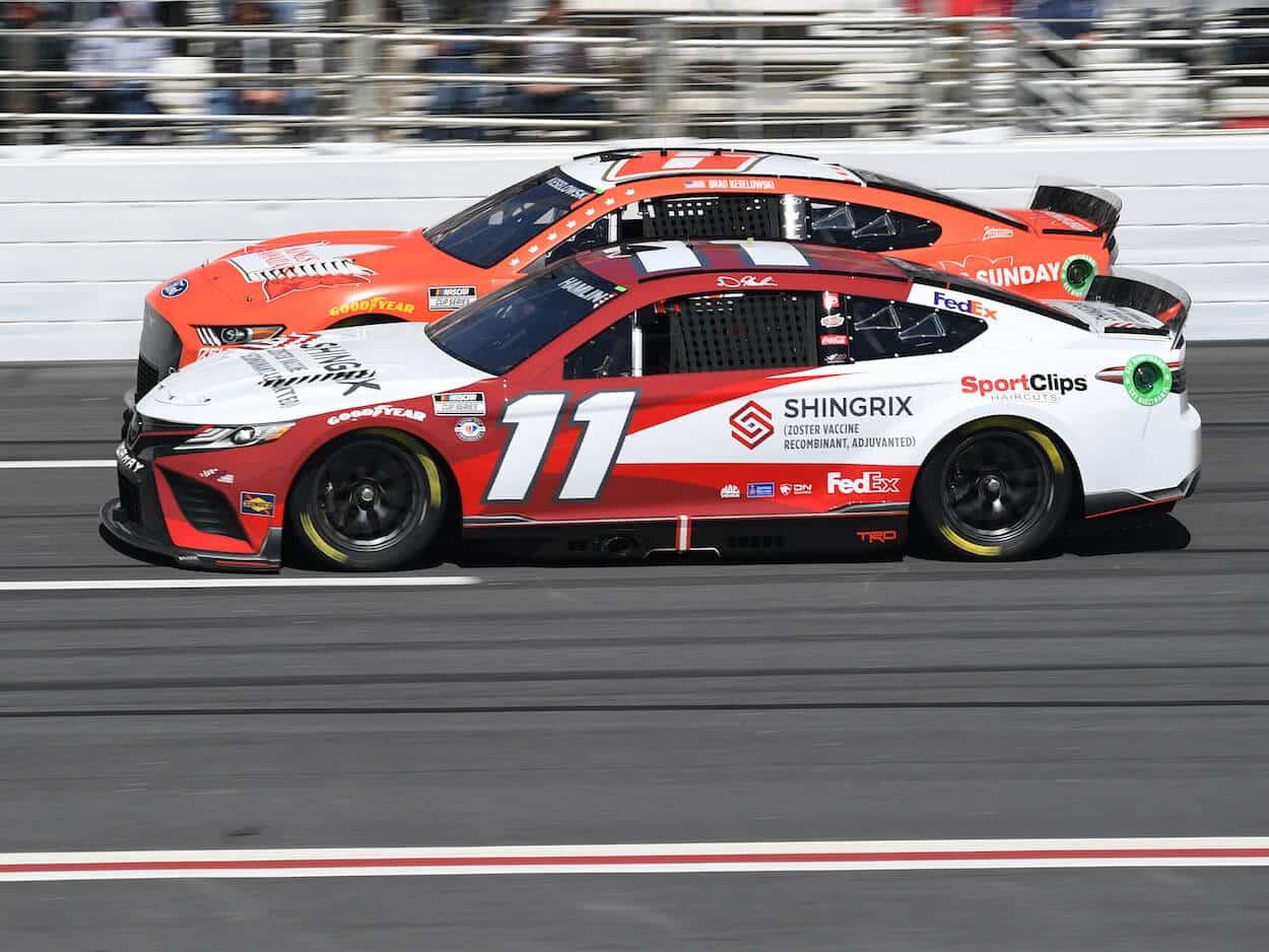 Brad Keselowski and Denny Hamlin race