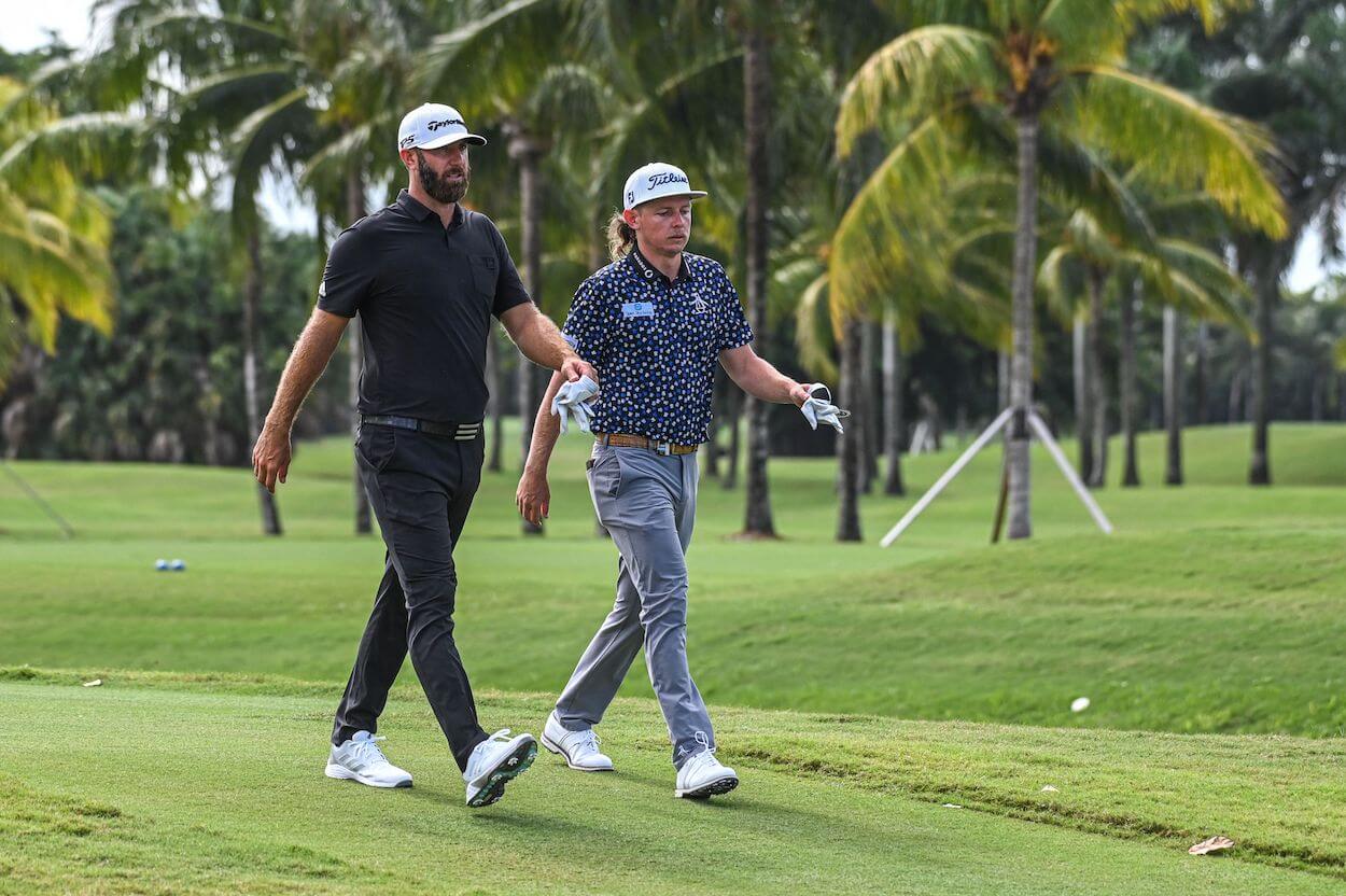 Dustin Johnson and Cameron Smith walk together during a LIV Golf event.