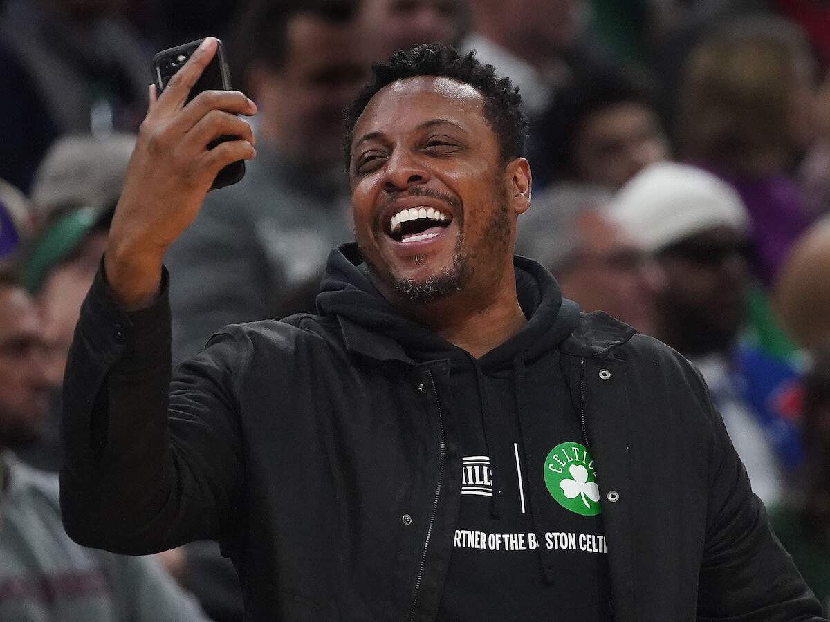 Former Boston Celtic Paul Pierce laughs at an NBA game