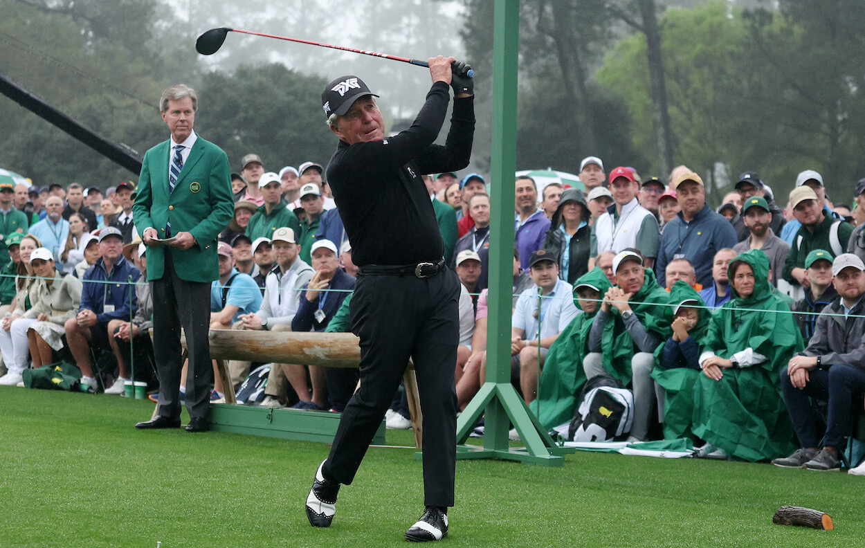 Gary Player hits his opening tee shot prior to the Masters.