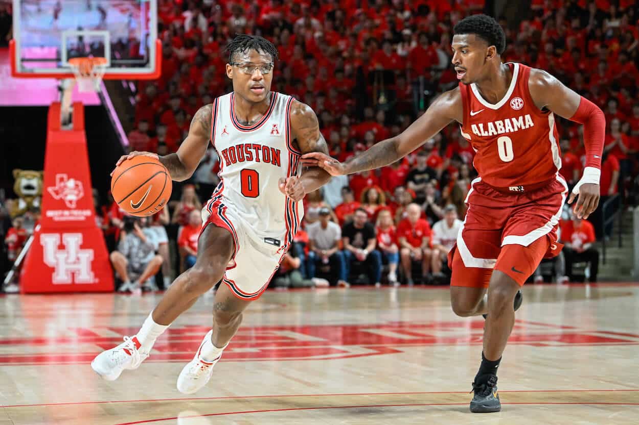 Marcus Sasser drives against Jaden Bradley.