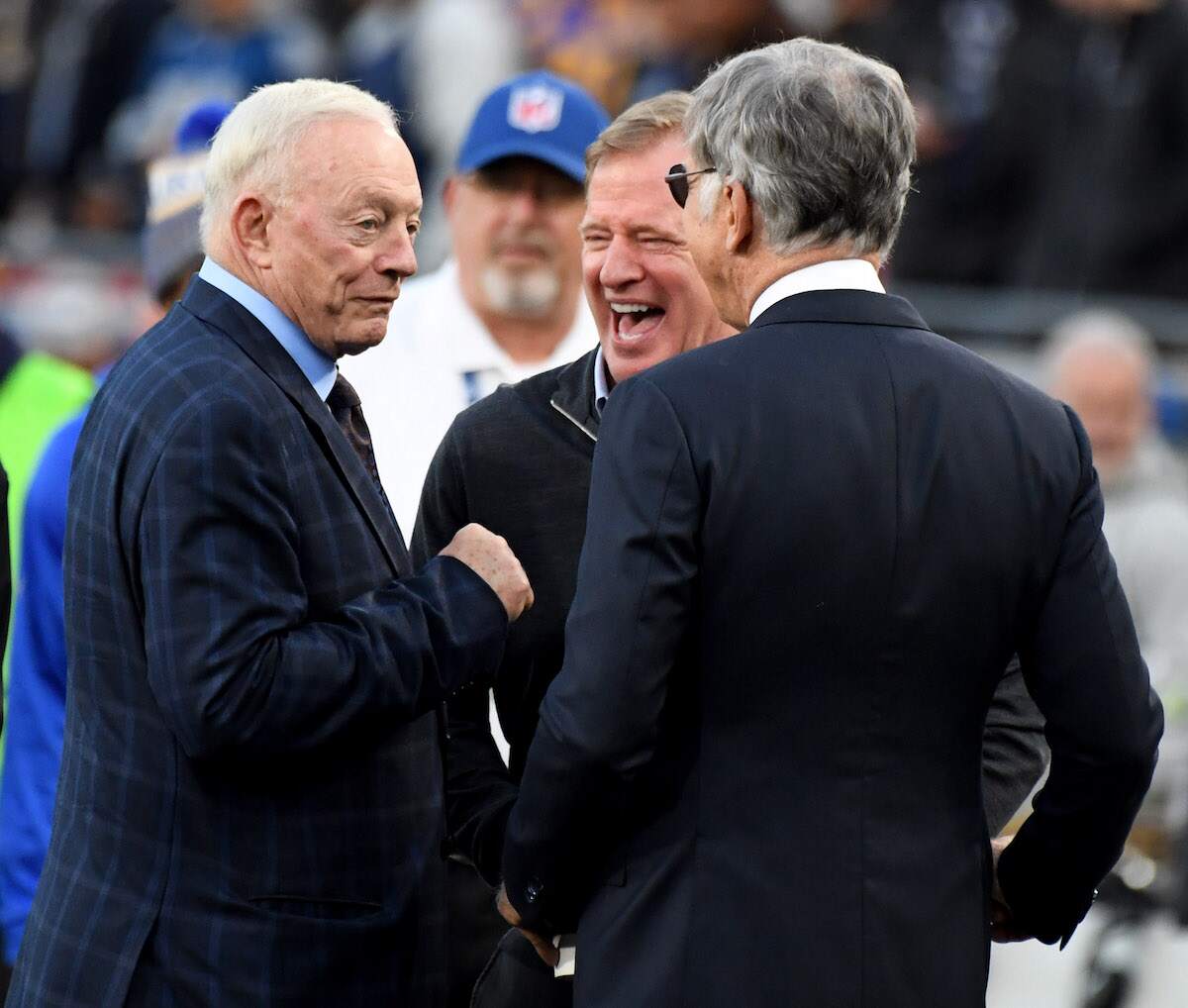 Dallas Cowboys owner Jerry Jones laughs with Los Angeles Rams owner Stan Kronke and NFL Commissioner Roger Goodell prior to an NFL playoff football game