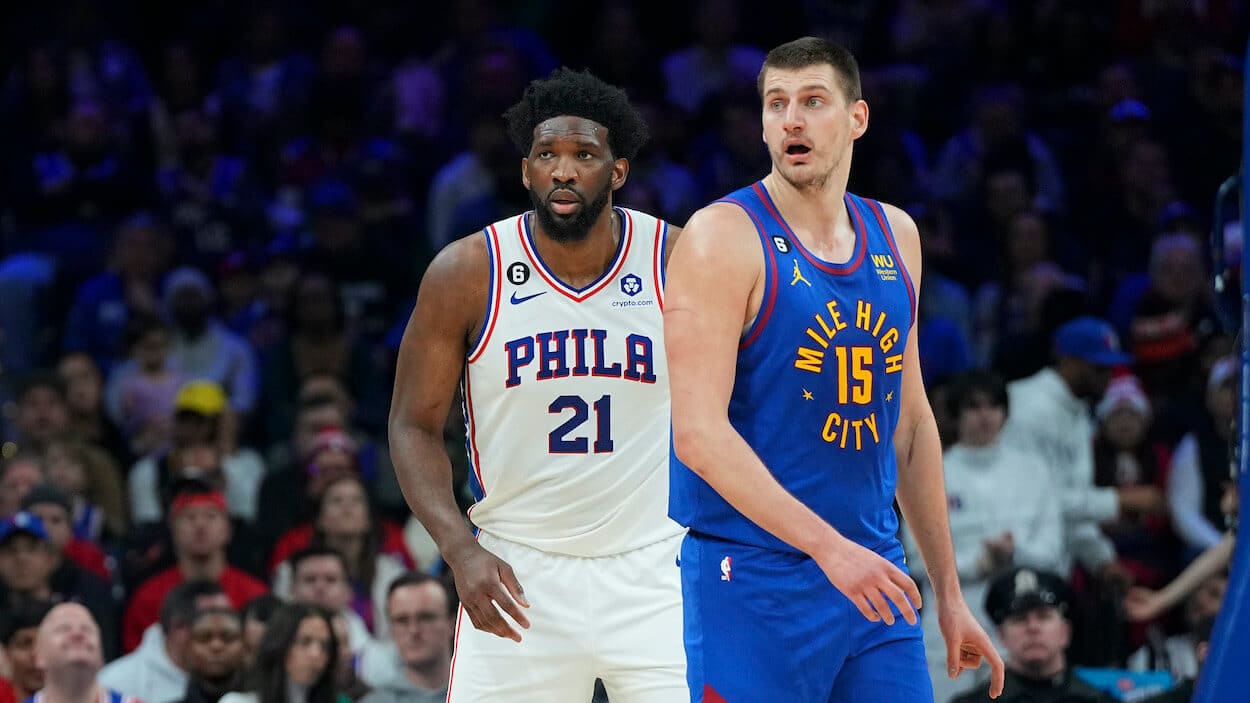 Joel Embiid guards Nikola Jokic.