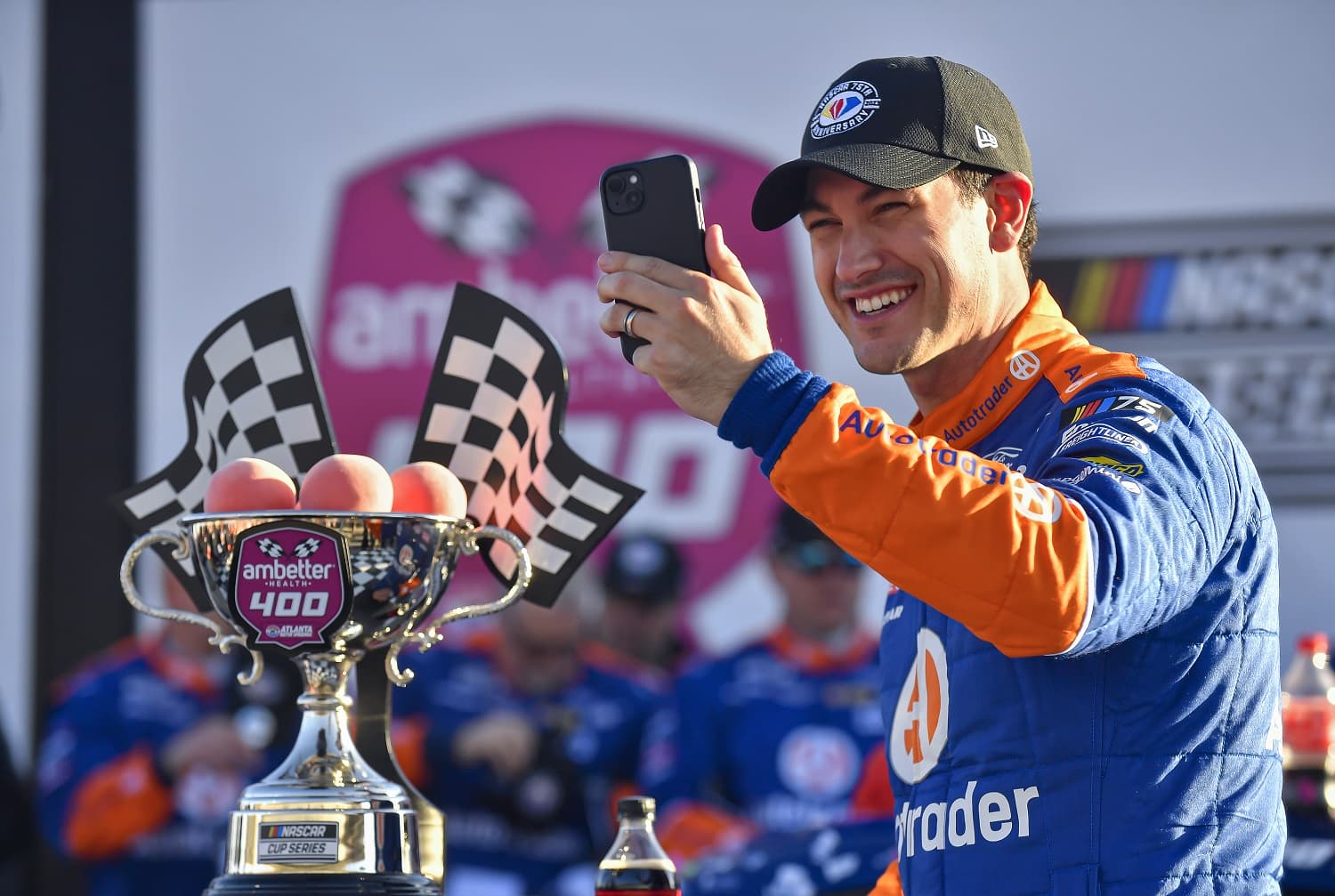 Joey Logano records a video with the trophy after winning the Ambetter Health 400 in the NASCAR Cup Series on , March 19, 2023 at Atlanta Motor Speedway.
