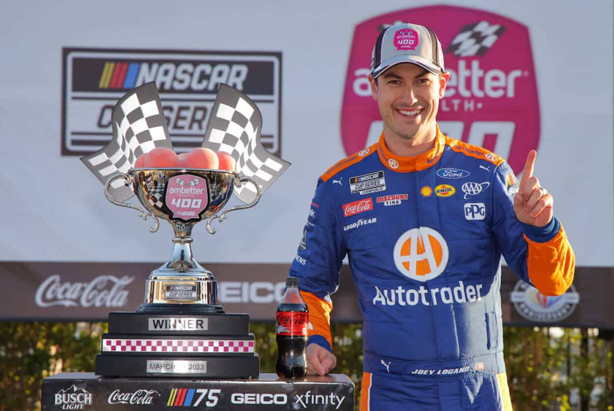 Joey Logano celebrates victory at Atlanta Motor Speedway.