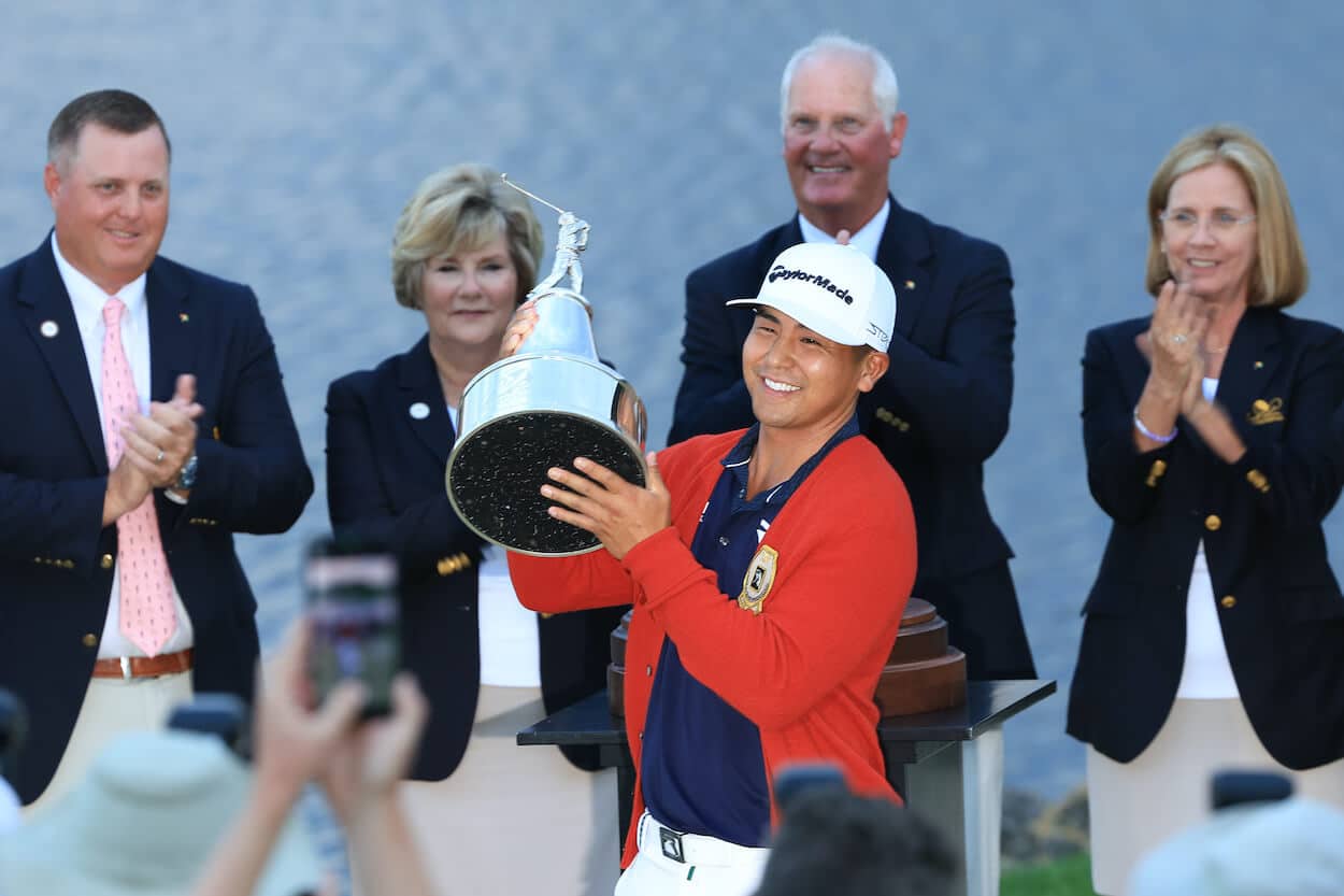 Kurt Kitayama celebrates with the Arnold Palmer Invitational trophy.