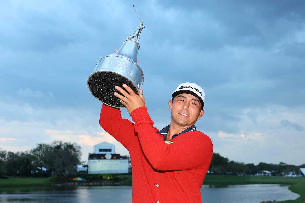 Kurt Kitayama celebrates with the Arnold Palmer Invitational trophy.