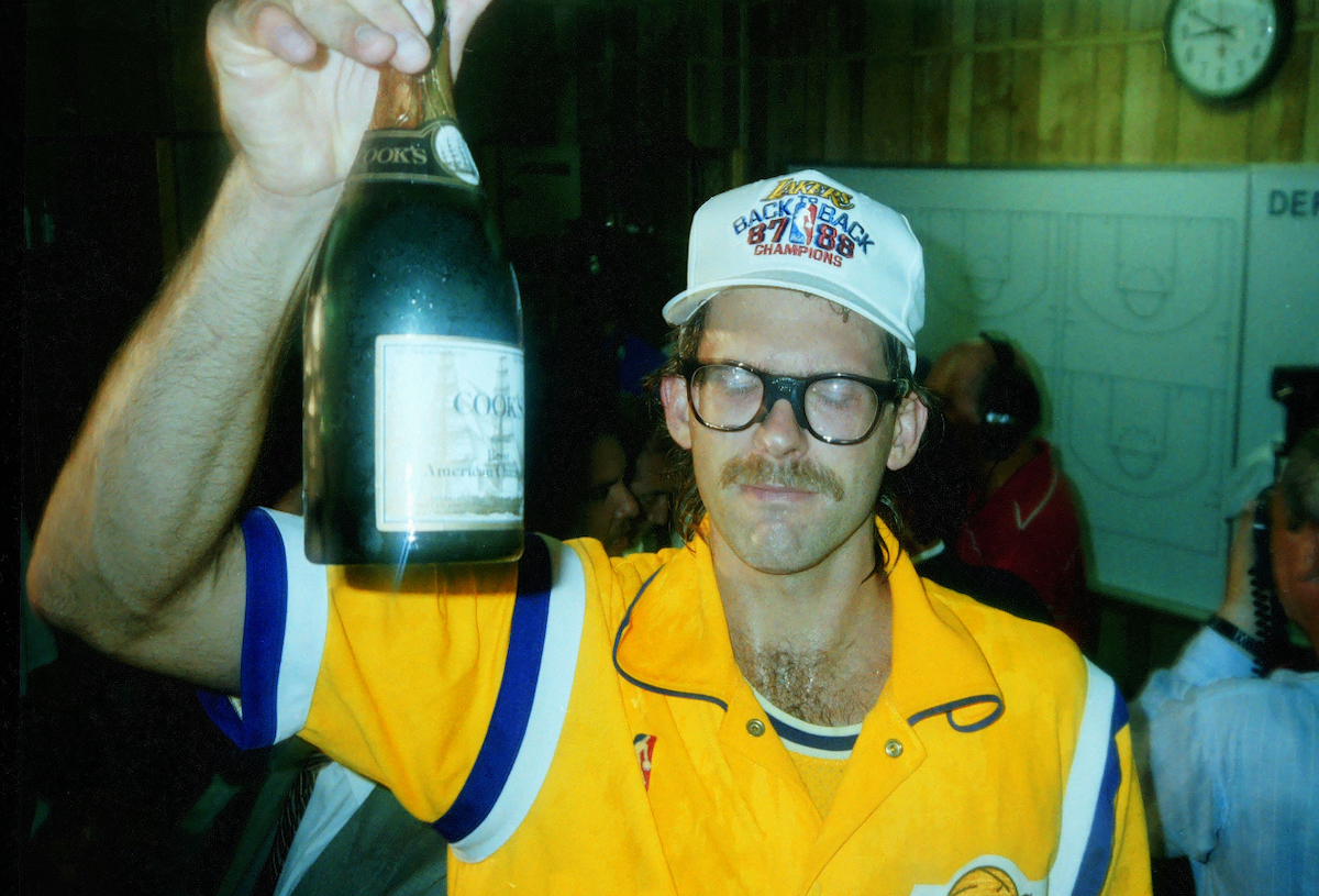 Kurt Rambis of the Los Angeles Lakers celebrates in the locker room after winning the 1988 NBA Finals, at The Forum, Los Angeles, California.