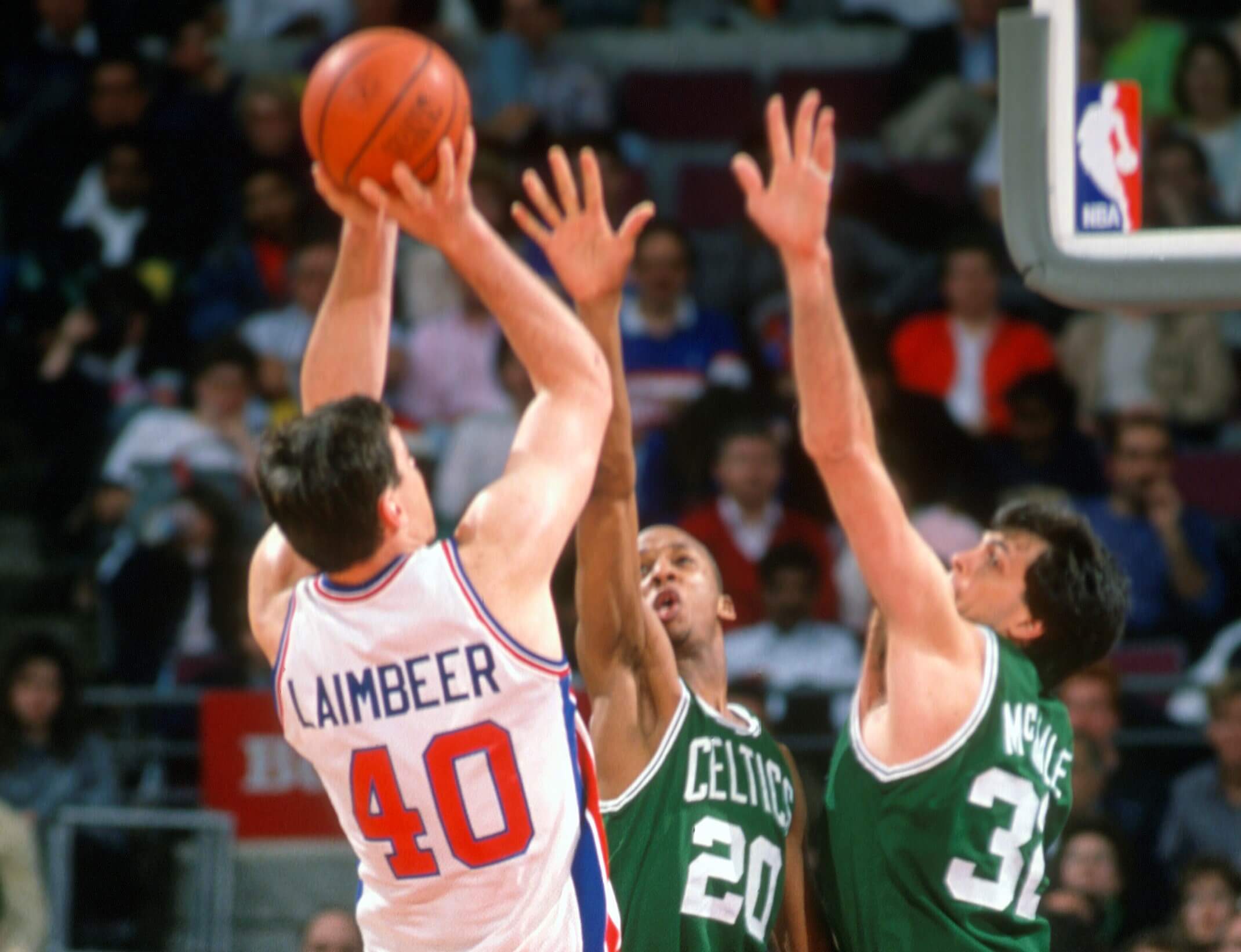 Bill Laimbeer of the Detroit Pistons shoots over Kevin McHale and Brian Shaw of the Boston Celtics.