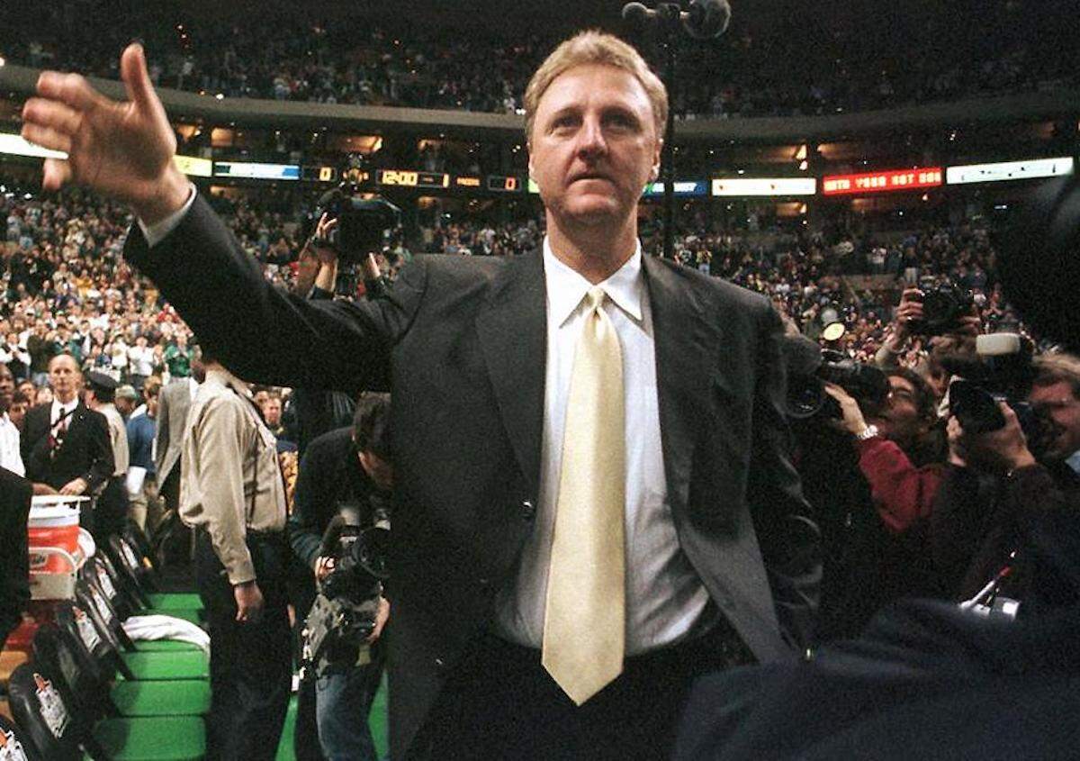 Larry Bird waves to the crowd before a game between the Boston Celtics and the Indiana Pacers in 1998