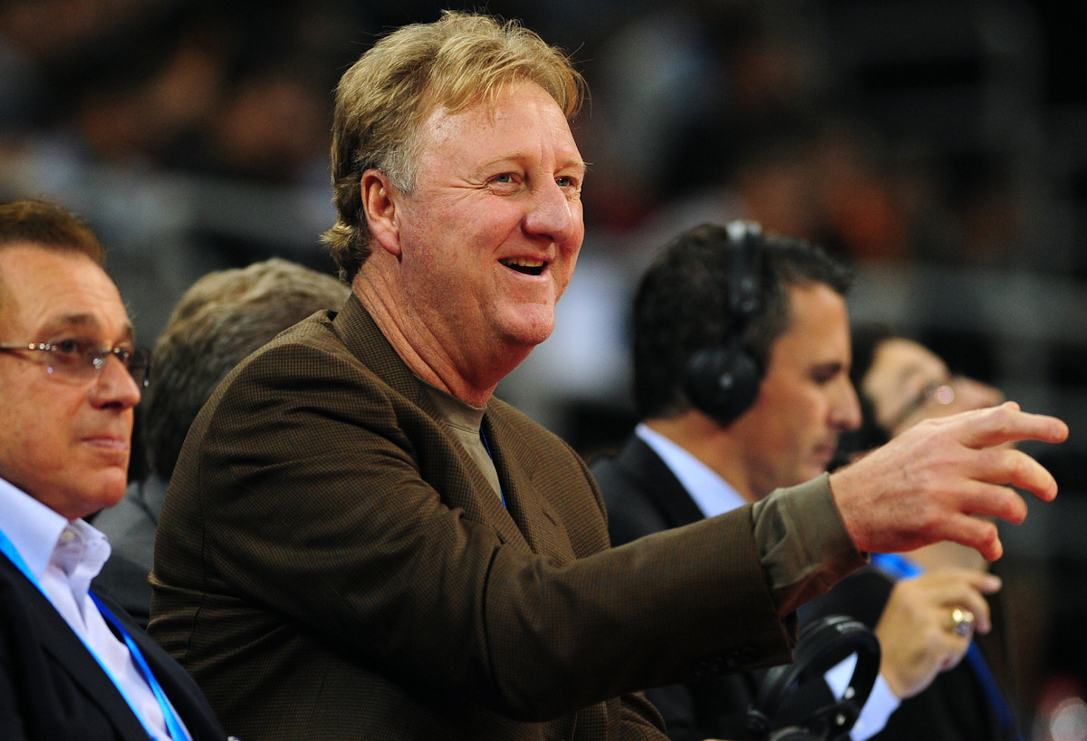 Larry Bird gestures from his seat during a game between the Denver Nuggets and Indiana Pacers on Oct. 11, 2009.