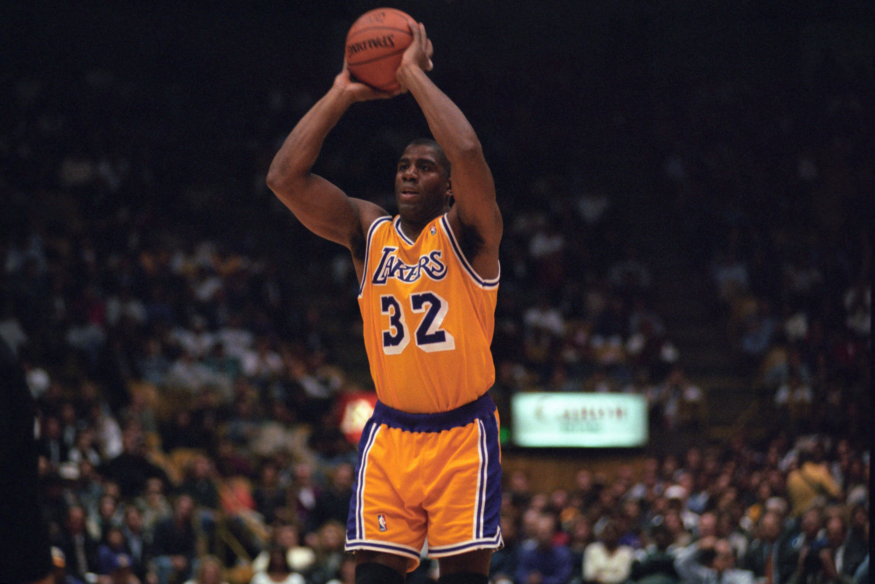 Magic Johnson of the Los Angeles Lakers passes the ball.