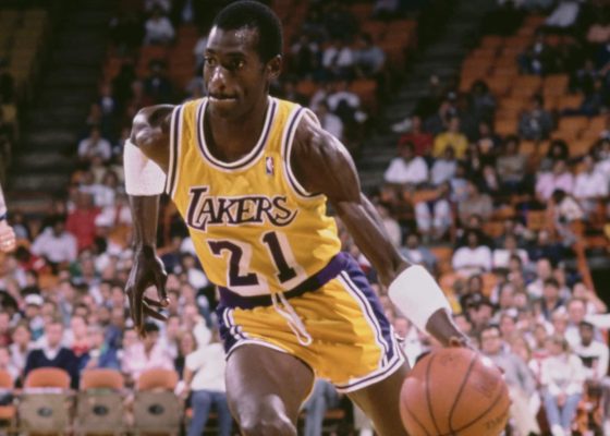 Michael Cooper of the Los Angeles Lakers dribbles the basketball.