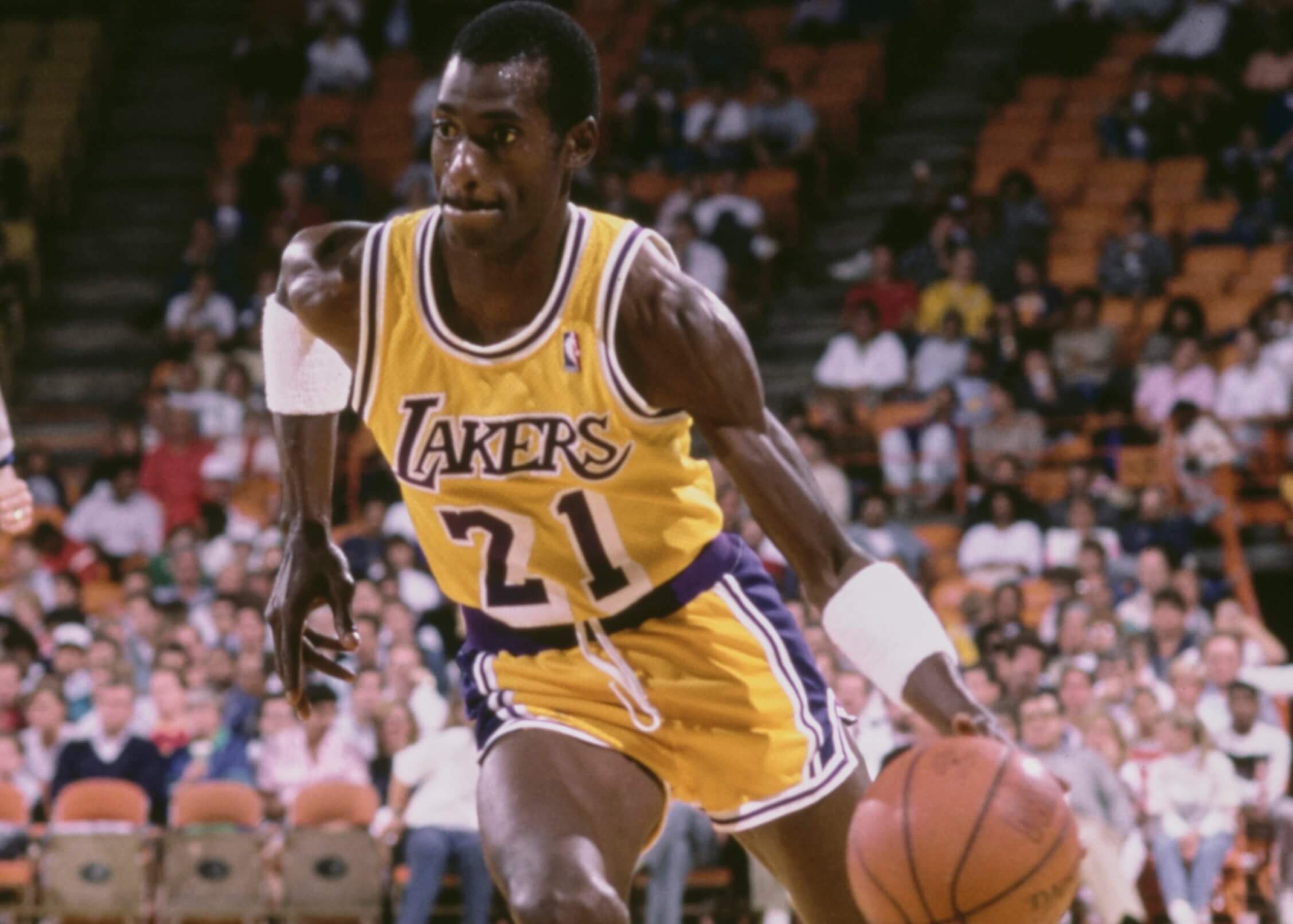 Michael Cooper of the Los Angeles Lakers dribbles the basketball.