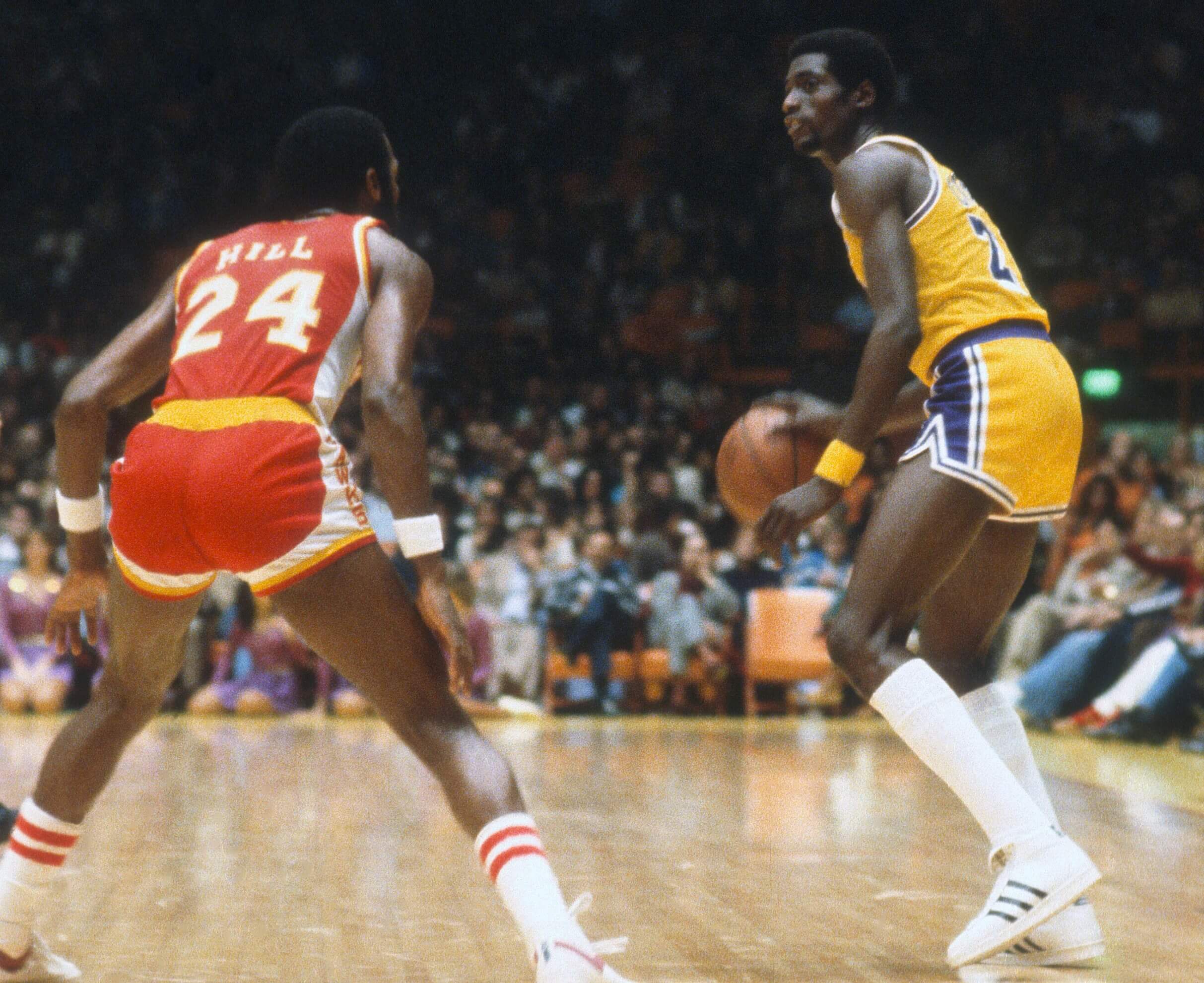 Michael Cooper of the Los Angeles Lakers dribbles the ball.