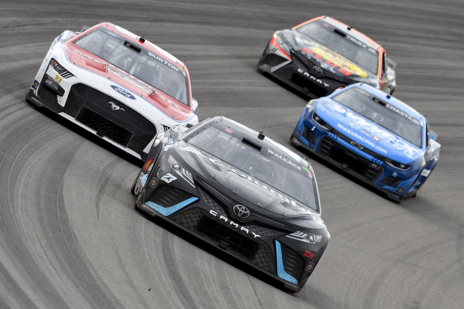 Bubba Wallace leads Harrison Burton, Ross Chastain, and Martin Truex Jr during the NASCAR Cup Series Pennzoil 400 on March 5, 2023, at Las Vegas Motor Speedway.