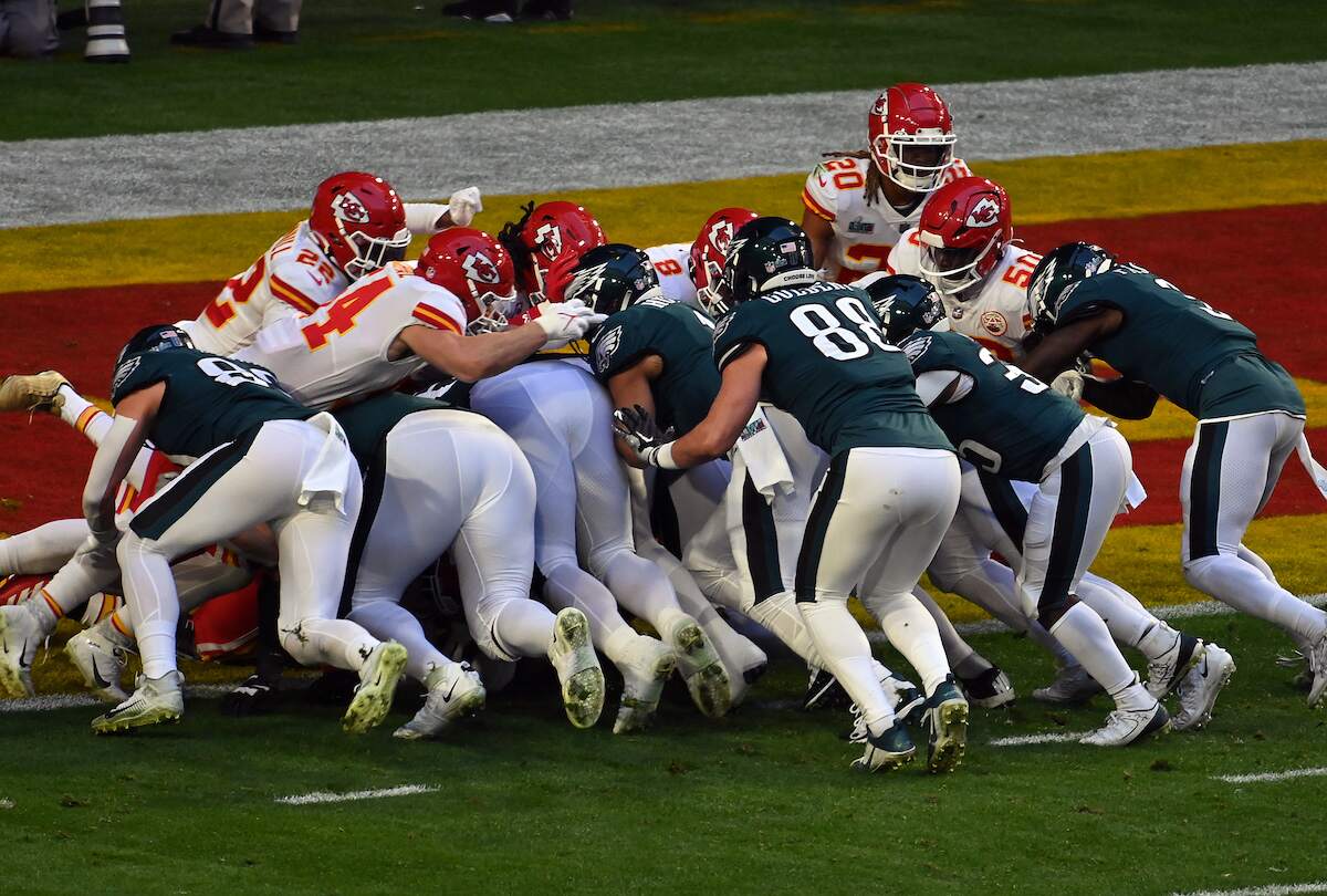 Jalen Hurts of the Philadelphia Eagles scores a touchdown against the Kansas City Chiefs during Super Bowl LVII