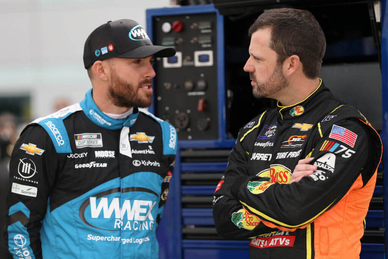 Ross Chastain (L) and Kyle Busch (R) talk during practice in Las Vegas.