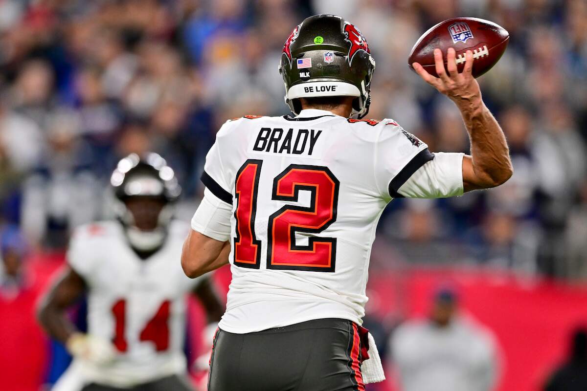 Tom Brady of the Tampa Bay Buccaneers throws a pass during a playoff game in 2023