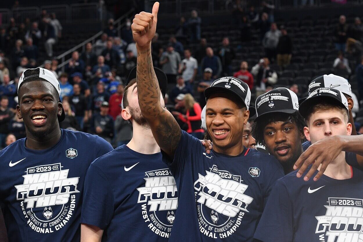 The UConn Huskies men's basketball team celebrates after earning a trip to the 2023 Final Four