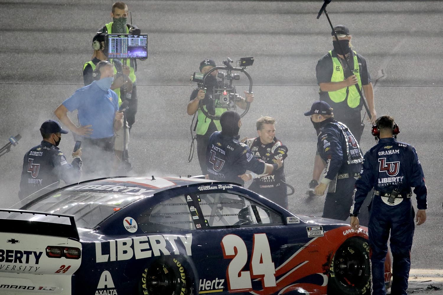 William Byron celebrates with his team after winning the NASCAR Cup Series Coke Zero Sugar 400 at Daytona International Speedway on Aug. 29, 2020, to clinch a playoff berth.