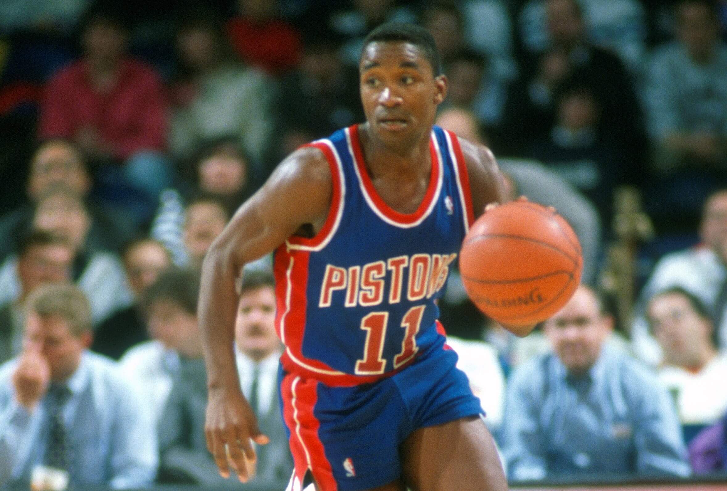 Isiah Thomas of the Detroit Pistons dribbles the ball upcourt.