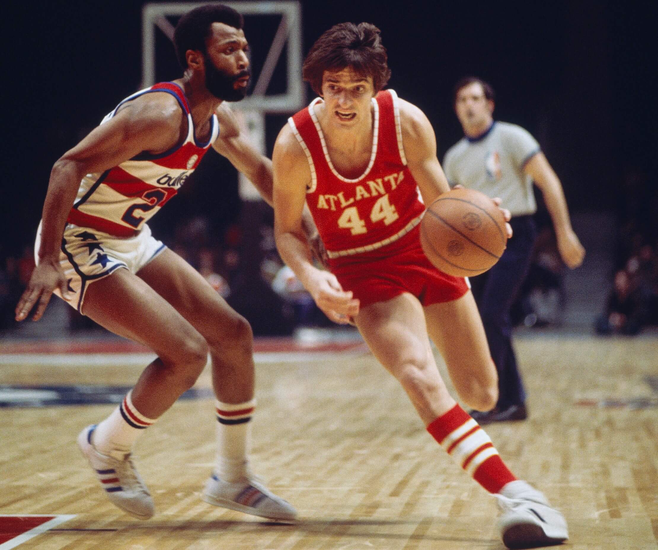 Atlanta Hawks guard Pete Maravich dribbles downcourt.