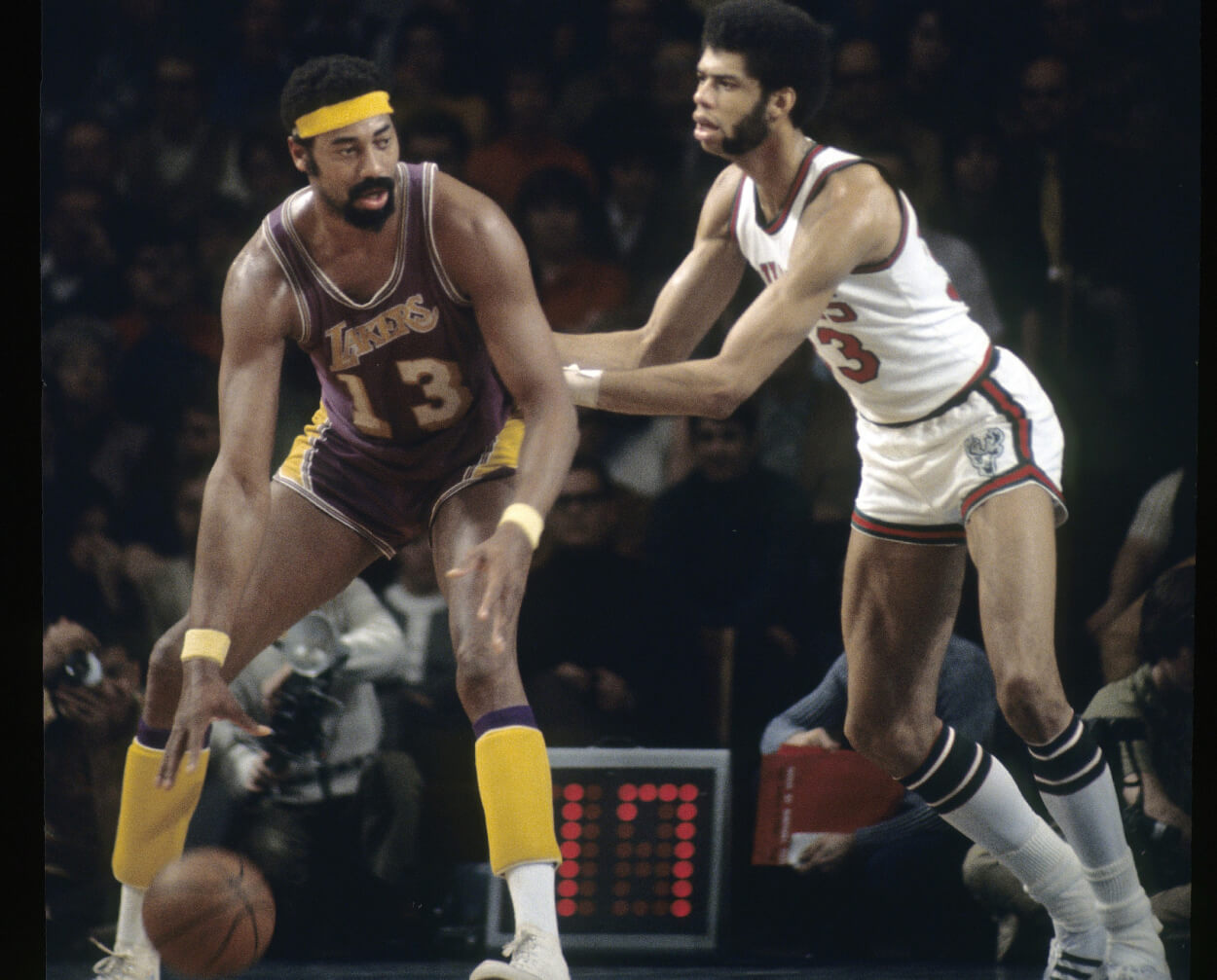 Wilt Chamberlain of the Los Angeles Lakers protects the ball down low against Kareem Abdul-Jabbar.
