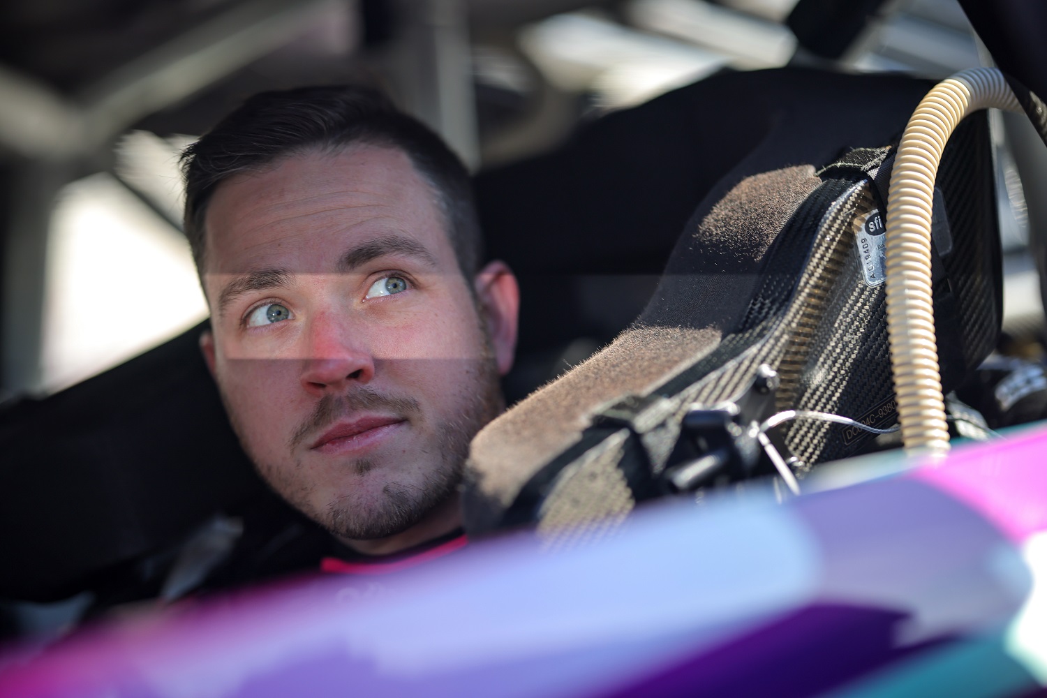Alex Bowman sits in his car during qualifying for the NASCAR Cup Series Ambetter Health 400 at Atlanta Motor Speedway on March 18, 2023.