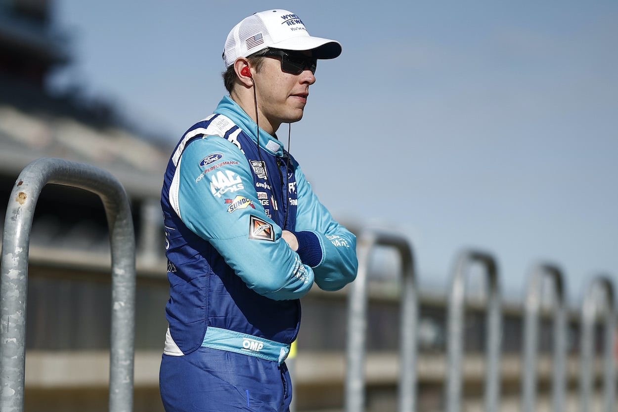 Brad Keselowski watches qualifying.