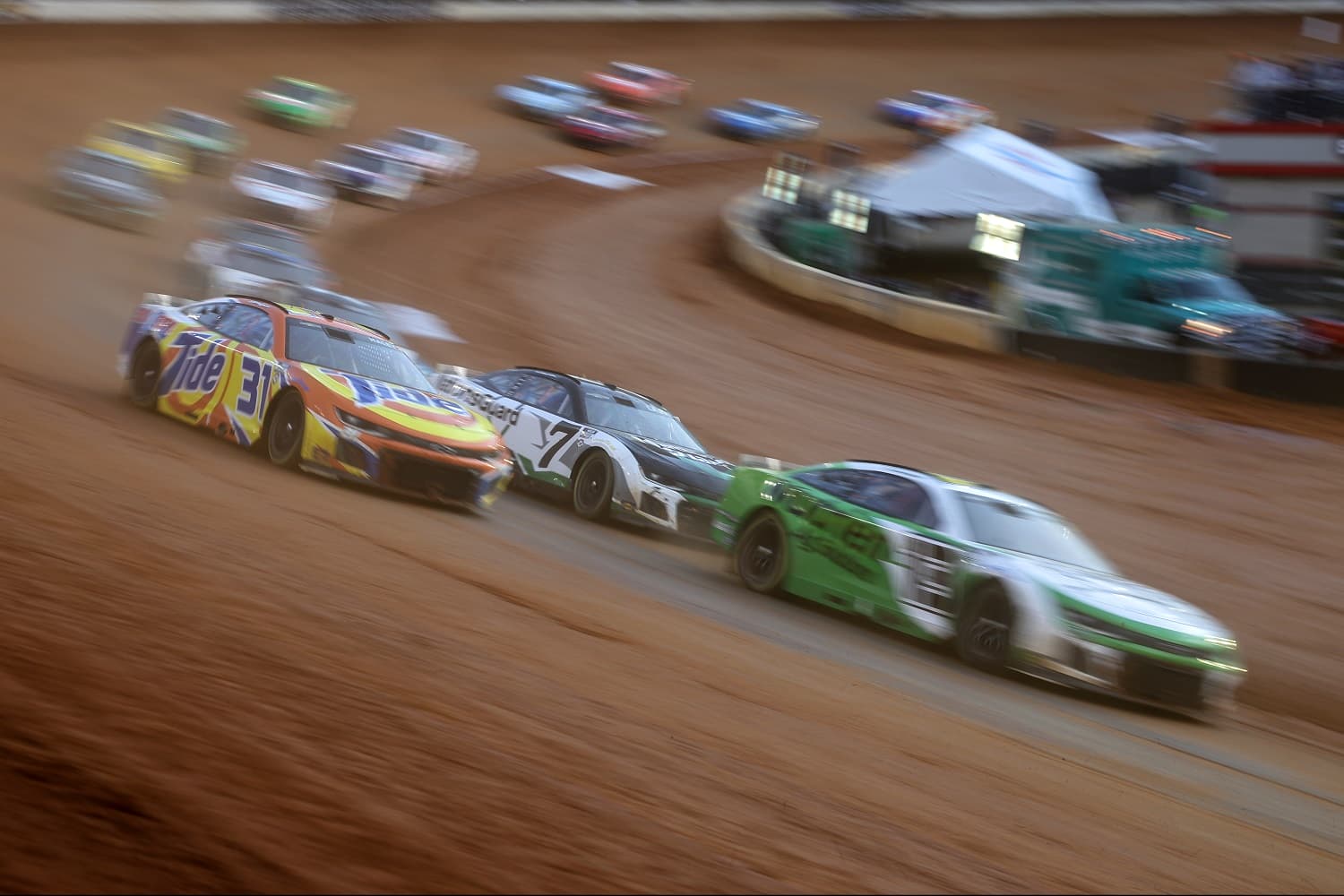 Justin Haley leads a pack in the middle of the field during the NASCAR Cup Series Food City Dirt Race at Bristol Motor Speedway on April 9, 2023. | James Gilbert/Getty Images